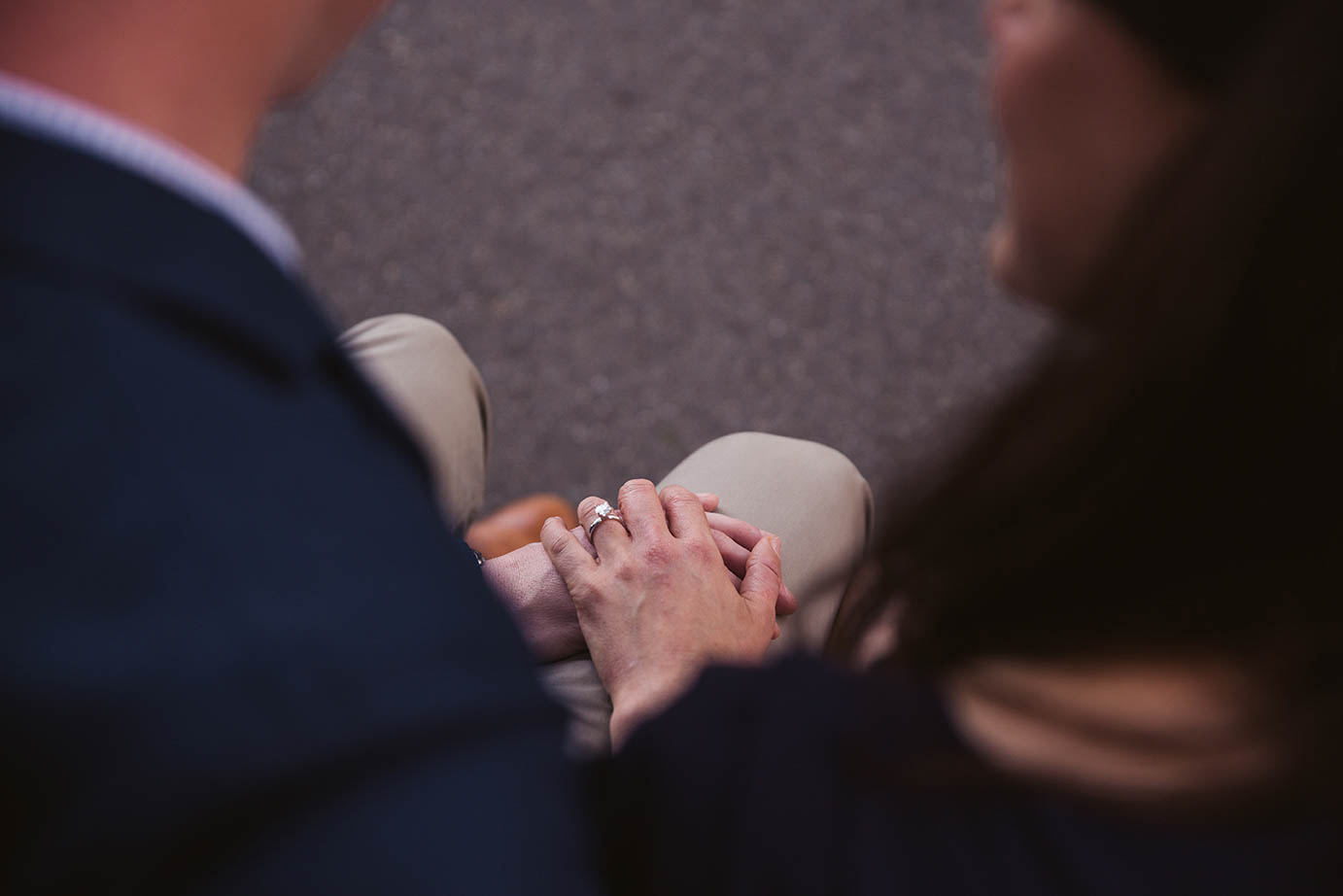 A documentary portrait of a couple holding hands at the Public Gardens during their Boston engagement session