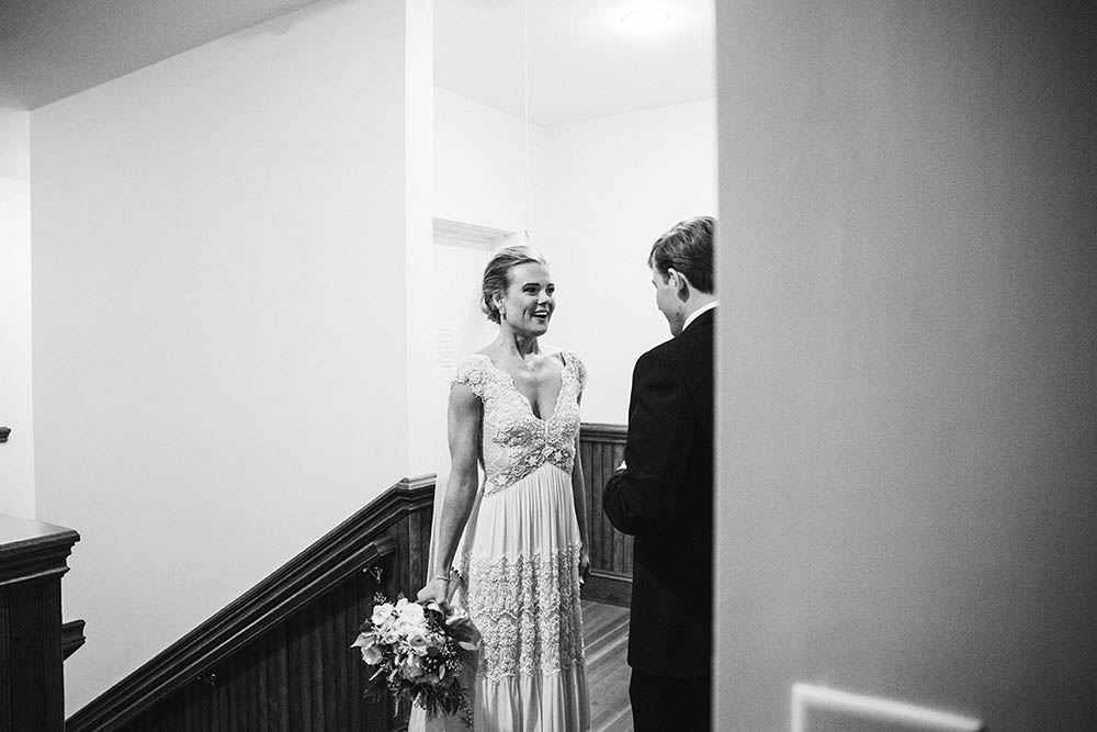 A documentary photograph of a bride and groom sharing an intimate moment after their wedding ceremony in Nantucket