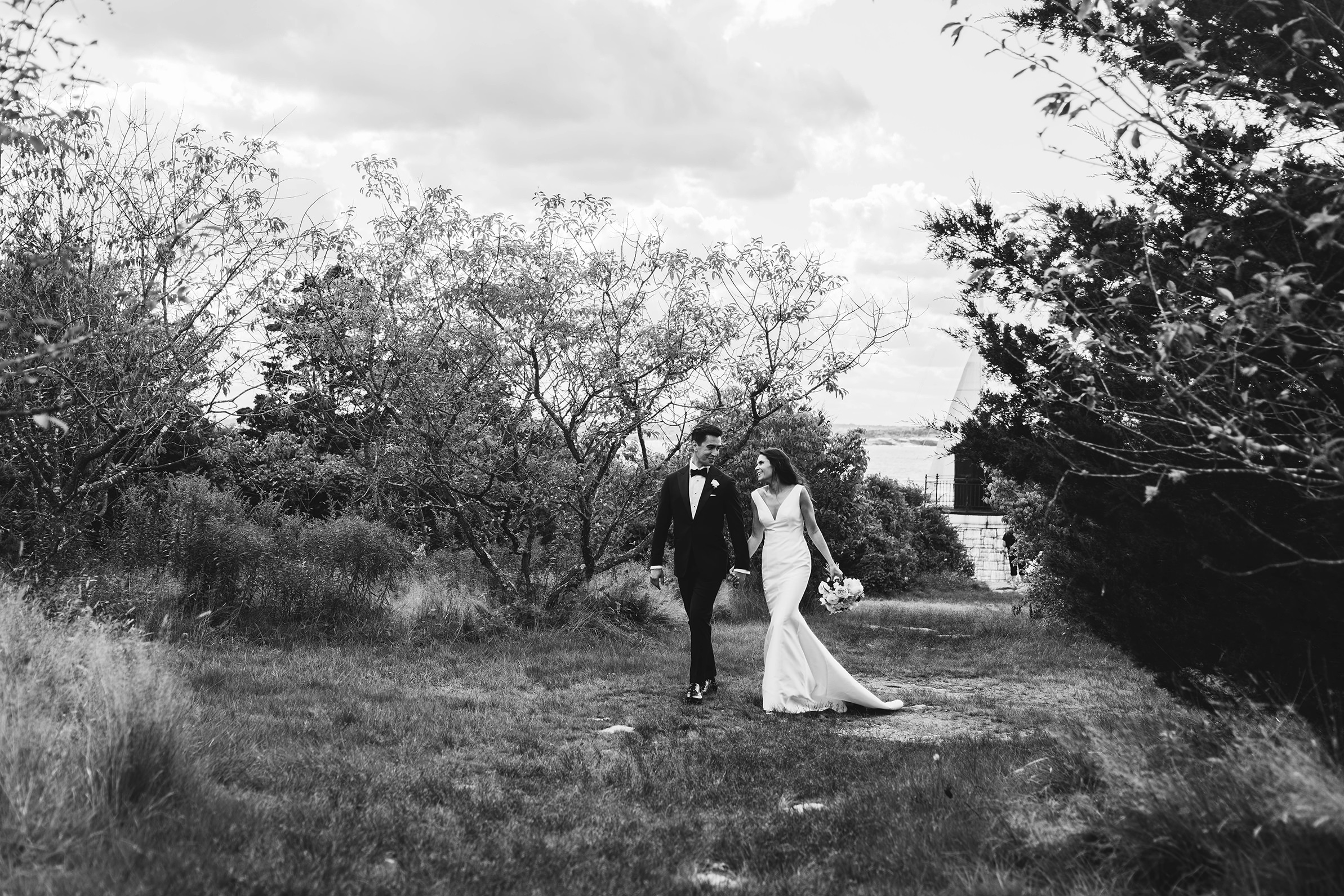 A documentary photograph featured in the best of wedding photography of 2019 showing a couple walking together during their castle hill inn wedding