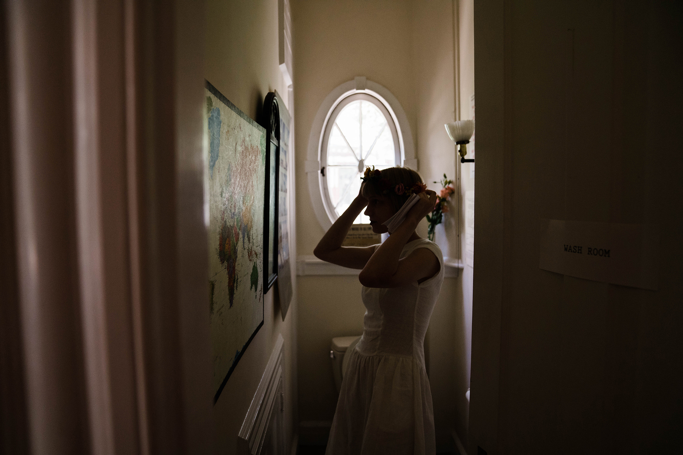 A documentary photograph featured in the best of wedding photography of 2019 showing a bride getting ready for her wedding