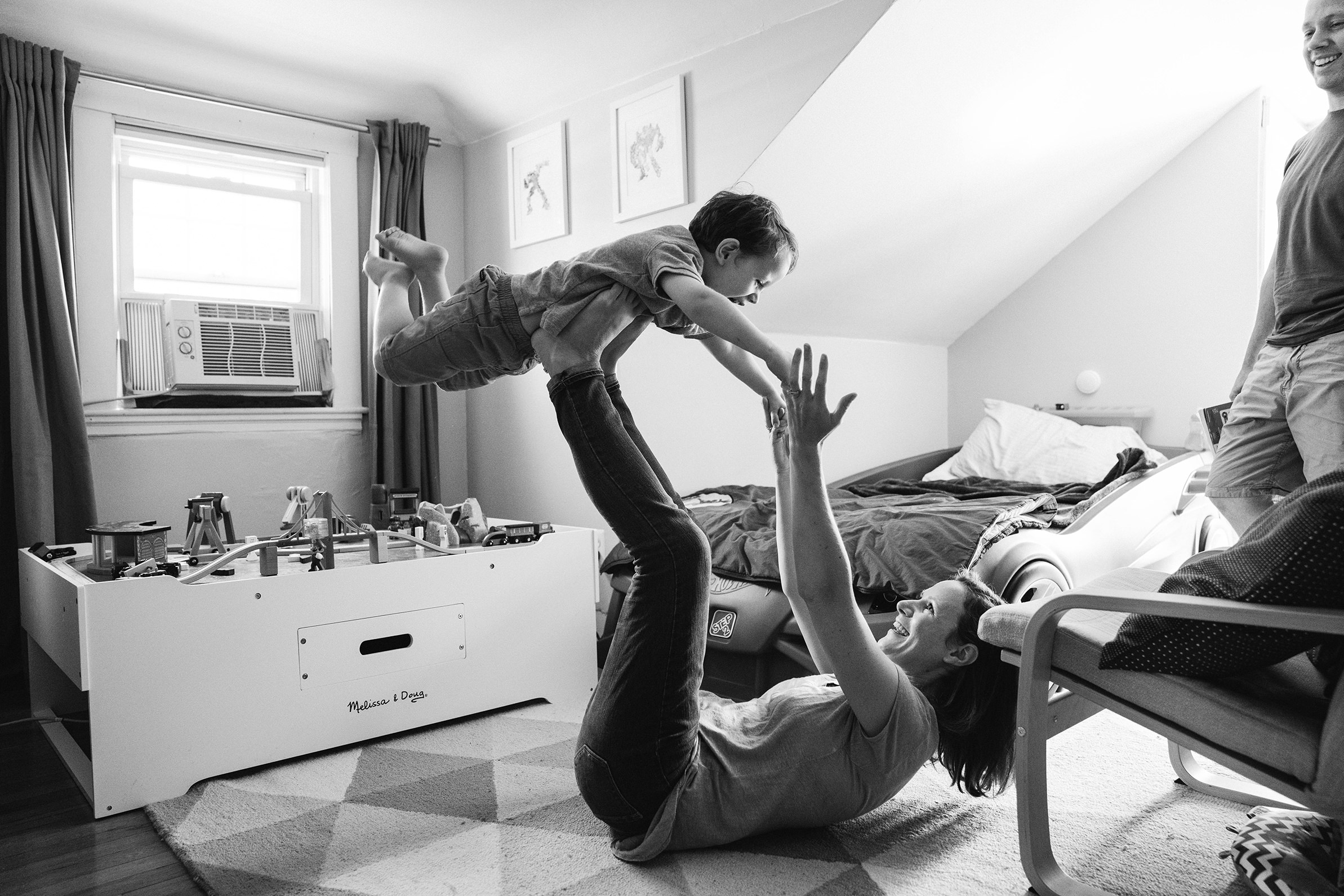 A best of Boston family photograph of mom playing with son during their in home family session in Boston