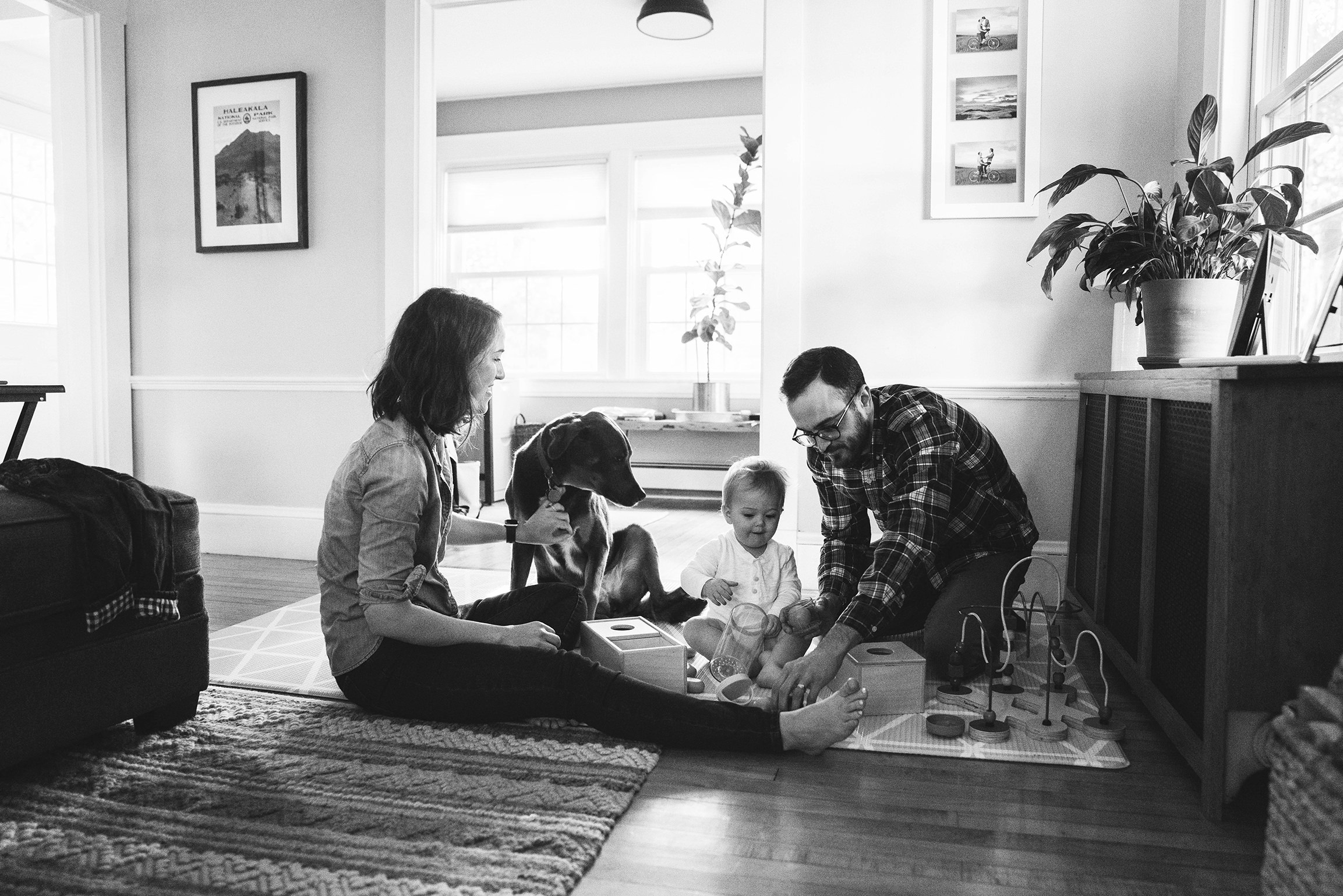 A best of Boston family photograph of family playing on a rug together during an in home family session in Boston